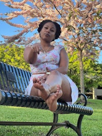 a woman sitting on a bench