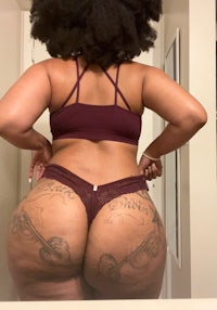 a woman with tattoos on her butt